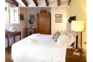 Кровать или кровати в номере Il Bagattino