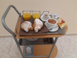 a tray of breakfast foods and drinks on a table at Vittorio Veneto Accomodation - Tropea city center in Tropea