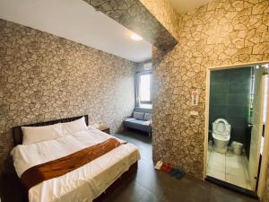 Ein Bett oder Betten in einem Zimmer der Unterkunft Yixiang Spring Travel