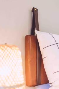 a book sitting next to a pillow next to at EDELFUCHS-LODGE in Bühlertal