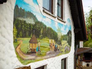 a painting on the side of a building at Ennerla Hof in Pottenstein