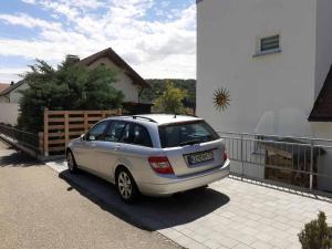 a silver car parked on the driveway of a house at Ferienhaus Gradaus in Riedenburg