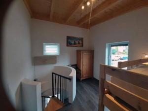 a room with a staircase with a table and a window at Ferienhaus Gradaus in Riedenburg