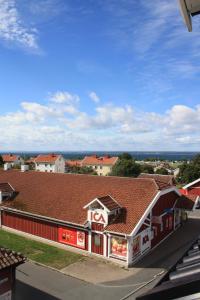a view of a building with a red roof at Grännagården in Gränna