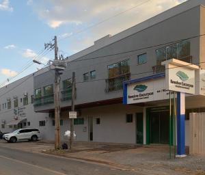 a building with a car parked in front of it at Suites Paraíso de Minas in Capitólio +30 photos