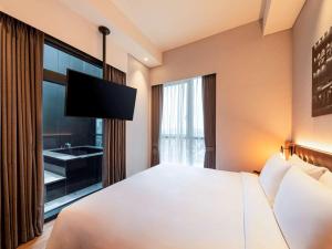 Mercure Ambassador Seoul Hongdae客房内的一张或多张床位