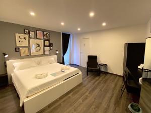Postel nebo postele na pokoji v ubytování Mimì Rooms&Studios