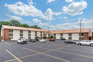 a parking lot with cars parked in front of a hotel at Comfort Inn West Hazleton in West Hazleton