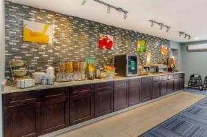 a restaurant with a counter in a room at Quality Inn Verona - Staunton North in Staunton