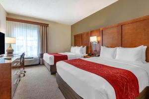 Voodi või voodid majutusasutuse Comfort Suites Newark - Harrison toas