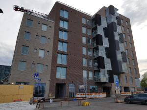 an apartment building under construction with a crane on top at New studio in West-Pasila in Helsinki