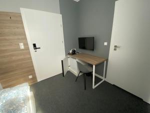 TV a/nebo společenská místnost v ubytování Hugo