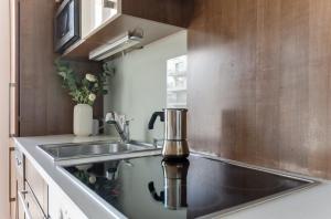 A kitchen or kitchenette at Teichmann Premium Apartments