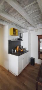 a kitchen with a sink and a counter top at Muziqa Apartments in Dubrovnik