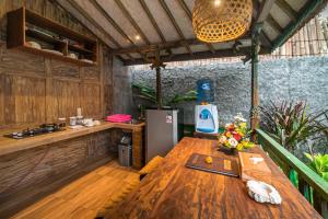 A kitchen or kitchenette at The Forest Villa Ubud