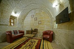 TV a/nebo společenská místnost v ubytování Cappadocia Fairy Tale Suites