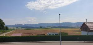 a view of a farm with a field and a street light at N37 -modern eingerichtete Zimmer in ruhiger Lage in Aldingen