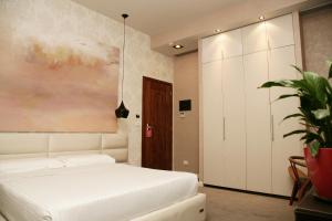 Postel nebo postele na pokoji v ubytování La Bohème Hotel
