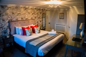 a bedroom with a bed and a night stand at Seacrest Hotel in Portsmouth