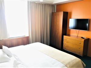Postel nebo postele na pokoji v ubytování Hotel Continental
