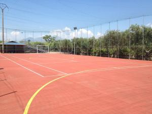 a tennis court with a net on top of it at Hotel San Gaetano in Grisolia
