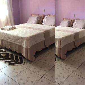 two beds in a room next to a room at Pousada Fora de Rota in Colinas Do Sul