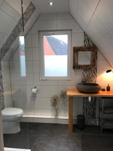 Ett badrum på T’ Hogeland Ainrom