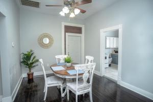 a dining room with a table and chairs at Remodeled Historic 2BR 1BA House Near Downtown in San Antonio