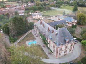 an aerial view of a large house with a yard at Château de Nettancourt in Nettancourt