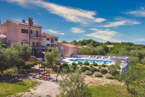 a villa with a swimming pool and a house at Mediterranean Luxury Villa Jele in Dobrinj