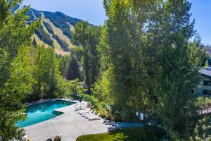 an overhead view of a swimming pool with trees and mountains at Prospector 205 in Ketchum