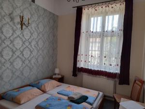 Ein Bett oder Betten in einem Zimmer der Unterkunft Kraków Hostel
