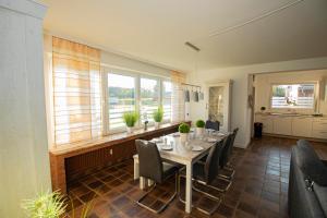 a dining room with a table and chairs at Haus Hagelshoek in Bad Bentheim +4 photos