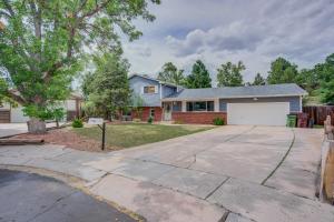 a house with a driveway and a garage at Wonderful Spacious 5BR Colorado Springs House in Colorado Springs