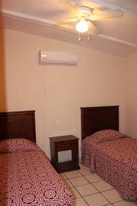 Postel nebo postele na pokoji v ubytování Hotel Boutique Real Tequila