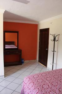 Postel nebo postele na pokoji v ubytování Hotel Boutique Real Tequila