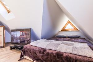 Posteľ alebo postele v izbe v ubytovaní Apartamenty Liptowskie Hale Zakopane