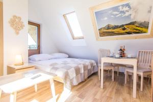 Posteľ alebo postele v izbe v ubytovaní Apartamenty Liptowskie Hale Zakopane