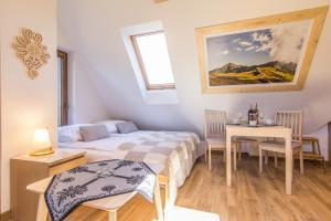 Posteľ alebo postele v izbe v ubytovaní Apartamenty Liptowskie Hale Zakopane