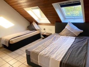 Katil atau katil-katil dalam bilik di Apartments Rhona III und IV Neunkirchen City