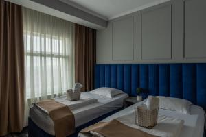 Un pat sau paturi într-o cameră la Hotel PASO