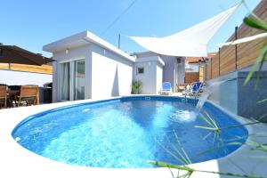 a swimming pool in the backyard of a house at Pop holiday house Zadar in Zadar