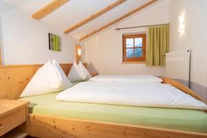 A bed or beds in a room at Sennerhof