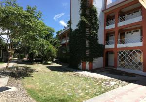 a building with trees on the side of it at HOTEL BUGAMBILIAS in Oaxaca City