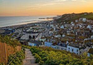 a view of a town with a beach and the ocean at The Jenny Lind in Hastings