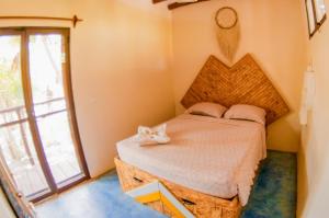Postel nebo postele na pokoji v ubytování Tribu Hostel