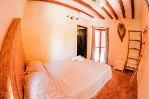 Postel nebo postele na pokoji v ubytování Tribu Hostel