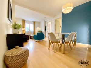 a living room with a dining room table and chairs at Charming Retiro Exclusive in Madrid
