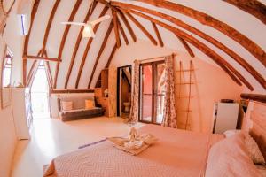 Postel nebo postele na pokoji v ubytování Tribu Hostel