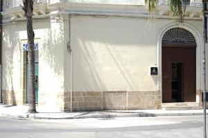 a building with a door on the side of a street at IL TRULLO Modern Rooms in Brindisi